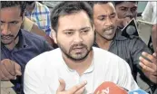  ?? PTI ?? Tejashwi Yadav talks to the media at the old secretaria­t before the cabinet meeting in Patna on Wednesday.