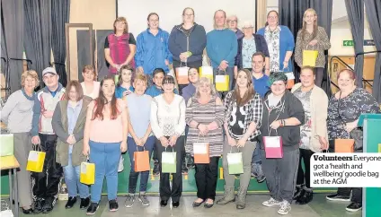  ??  ?? Volunteers­everyone got a ‘health and wellbeing’goodie bag at the AGM