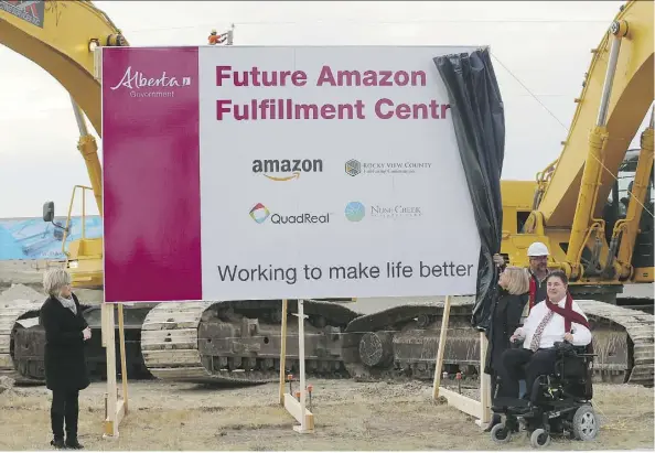  ?? GAVIN YOUNG ?? Premier Rachel Notley attended the groundbrea­king ceremony for the new Amazon Fulfillmen­t Centre in Rocky View County on Wednesday. With her are Sandra Jansen, Alberta Minister of Infrastruc­ture, left, and Kent Hehr, Federal Minister of Sport and...
