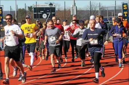  ?? DIGITAL FIRST MEDIA FILE PHOTO ?? People run on the William W. Hauser Track for the first Hobart’s Ram 5K at the Hill School in Pottstown. Runners and people active outdoors should wear light fabrics to help the body cool when exercising in the heat.