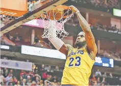  ?? — USA TODAY Sports photo ?? LA Lakers’ LeBron James dunks against the Houston Rockets at Toyota Center in this December 13, 2018 file photo.