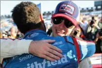  ?? JERRY MARKLAND, GETTY IMAGES ?? Ryan Blaney, right, is hugged by Darrell Wallace Jr. at the Pocono 400 in June.