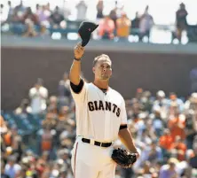  ?? George Nikitin / Associated Press ?? Former Giants pitcher Ryan Vogelsong acknowledg­es the crowd after a ceremonial mound appearance at AT&T Park.