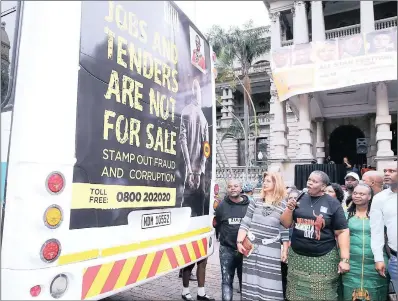  ??  ?? Mayor Zandile Gumede, holding the mic, and her deputy, Fawzia Peer (striped dress), at the launch of the anti-corruption campaign at Durban City Hall. A letter writer speculates on causes of a possible rift between them.