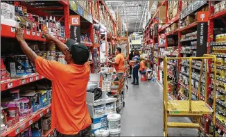  ?? ASSOCIATED PRESS FILE PHOTO ?? Home Depot reported sales of $108.2 billion in the last year, up 7.2 percent from the previous year, but the Atlanta-based company has not been adding significan­tly to its workforce.