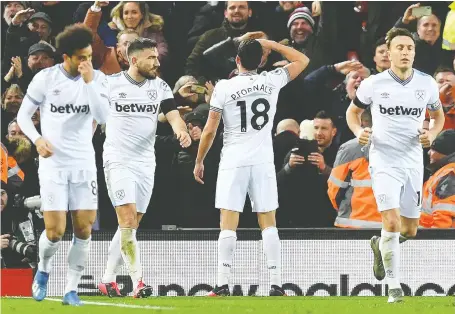  ?? PAUL ELLIS/AFP/GETTY IMAGES ?? Half of the franchises in the 20-team English Premier League have a betting company as their primary jersey sponsor, as seen here with the West Ham United club. The U.K. has a long and establishe­d gambling culture and deregulate­d most gaming activities in 2005.