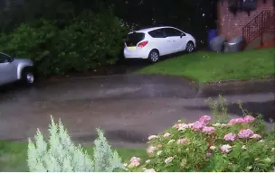  ?? ?? ●●Water pouring down Coupland Close