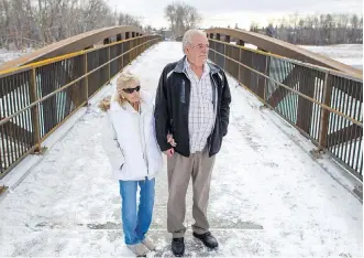  ?? GAVIN YOUNG ?? Darlene and Doug Boyd stand on the Laurie Boyd Bridge, which is to be officially opened in a ceremony on Friday. The bridge was named in honour of their daughter, who was murdered in Okotoks in 1982.