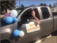  ??  ?? Below: Amberlee Goreham gets ready to roll out for a number of birthday surprises around the city. A group of dedicated Hatters is doing safe, drive-by celebratio­ns for people of all ages who are not able to host parties.