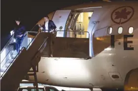  ?? The Canadian Press ?? Vancouver Canucks’ Loui Eriksson, left, and Tyler Toffoli step off the NHL team’s charter plane at Vancouver Internatio­nal Airport on Thursday after returning home from Phoenix.