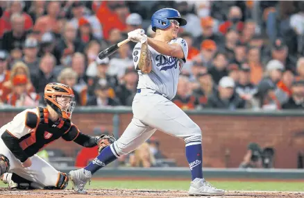 ?? USA TODAY SPORTS ?? Dodgers starting pitcher Julio Urias follows through on an RBI single against the Giants in the second inning at Oracle Park.
