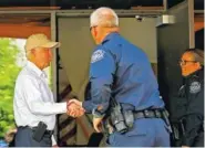  ?? THE ASSOCIATED PRESS ?? Attorney General Jeff Sessions, left, shakes hands with U.S. Customs and Border Protection officers as he tours the U.S.-Mexico border Tuesday.