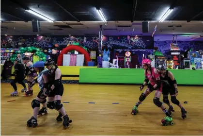  ?? ?? Members of New York’s Long Island Roller Rebels practice drills at the United Skates of AmericaRol­ler Skating facility in Massapequa on Tuesday. Photograph: Shannon Stapleton/Reuters