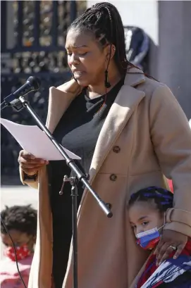  ?? PAUL CONNORS / BOSTON HERALD ?? RAISING CONCERNS: Shirley Porcena, mother of Melody Cubias, 5, right, addresses teachers and parents of students of color concerning the challenges she faced during the pandemic, during an education protest at the State House on Saturday.