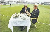  ??  ?? My dear old thing: Blofeld chats over tea with Geoffrey Boycott during a Test match in Trent Bridge in 1991, left, and, main picture, catches up with Michael Vaughan in 2014