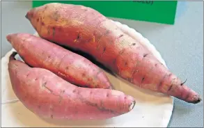  ??  ?? LEFT: Joseph Riggins, of Oklahoma City, had the first-place entry in the Vegetables (sweet potatoes, red gold) category at the Oklahoma County Free Fair.