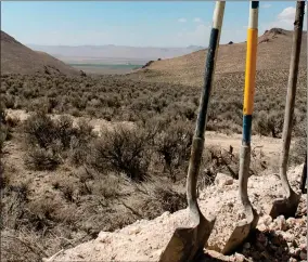  ?? AP PHOTO BY SUZANNE FEATHERSTO­N/THE DAILY FREE PRESS ?? Exploratio­n drilling continues for Permitting Lithium Nevada Corp.’s Thacker Pass Project on the site between Orovada and Kings Valley, in Humboldt county, Nev., shown beyond a driller’s shovels in the distance on Sept. 13, 2018. Conservati­onists are seeking an emergency court order to block constructi­on of a lithium mine near the Nevada-oregon line. The new request filed Tuesday, Feb. 21, 2023, in federal court in Reno comes after a judge there directed the U.S. Bureau of Land Management to revisit part of its approval of the plans but allowed constructi­on to go forward in the meantime.