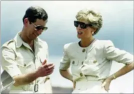  ?? Photos and text from wire services ?? In this April 23, 1991, photo, Britain’s Prince Charles and Princess Diana laugh together during their visit to an iron ore mine near Carajas, Brazil.