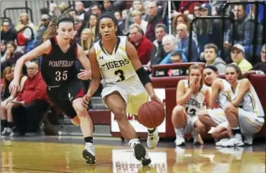  ?? CATHERINE AVALONE — REGISTER ?? Hand’s Gabby Martin, right, scored her 1,000th career points in Saturday’s win over Pomperaug.