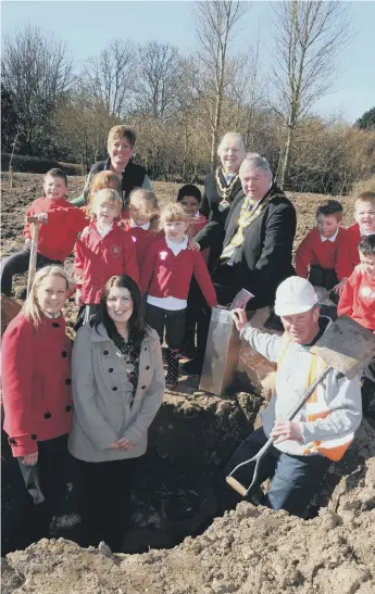  ??  ?? Burying a time capsule in the new developmen­t area of Barnes Park in 2011.