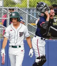  ?? Jason Fochtman / Staff photograph­er ?? P.J. Villarreal of The Woodlands reacts after striking out to end Game 3 on Saturday at Corsicana.