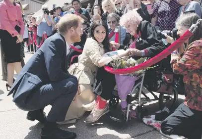  ?? Reuters ?? G’DAY. Meghan, Duchess of Sussex, and Prince Harry, Duke of Sussex, meet 98-year-old royal watcher Daphne Dunne – ‘Harry’s biggest fan’ as she said – at the Sydney Opera House in Australia yesterday.Picture: