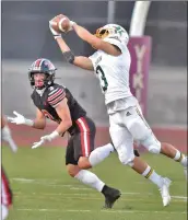 ?? Dan Watson/The Signal ?? Canyon High’s Colin Figueroa (3) intercepts a pass meant for Hart High wide receiver Luke Madison (9) in the first quarter at Valencia High School on Friday.