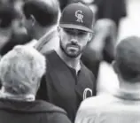  ?? David Zalubowski, The Associated Press ?? Rockies first baseman Ian Desmond talks to reporters Monday at Coors Field after taking batting practice for the first time since his hand was broken by a pitch during spring training.