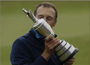  ?? ALASTAIR GRANT — ASSOCIATED PRESS ?? Jordan Spieth kisses the claret jug after winning the British Open championsh­ip Sunday at Royal Birkdale, Southport, England.