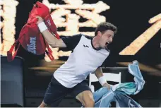  ?? Reuters; AP ?? Novak Djokovic, top, on his way to a four-set victory over Daniil Medvedev yesterday, while Pablo Carreno Busta, above, throws his bag in frustratio­n after losing to Kei Nishikori