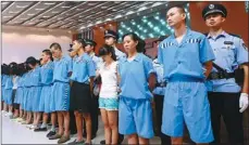  ?? HUANG RONG / FOR CHINA DAILY ?? Fifty-six people were sentenced at Xiamen Intermedia­te People’s Court on Thursday in Fujian province on transnatio­nal telecom scam charges. The sentences ranged from 27 months to 12 years, along with fines of 2,000 yuan to 100,000 yuan ($327.00 to...