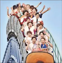  ?? AFP ?? ‘No screaming on the roller coaster’ will be one of the new rules when Japanese amusement parks reopen.