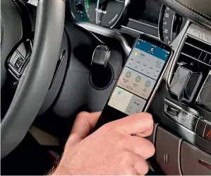  ?? SUPPLIED ?? QLYX is a smartphone mount for your car that automatica­lly launches an app.