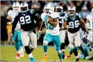  ?? AP PHOTO BY BOB LEVERONE ?? Miami Dolphins' Kenyan Drake (32) runs for a touchdown against the Carolina Panthers in the second half of an NFL football game in Charlotte, N.C., Monday.