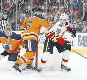  ?? CODIE McLACHLAN/GETTY IMAGES ?? New Oilers assistant captain Adam Larsson tangles with Calgary left wing Matthew Tkachuk on Wednesday.