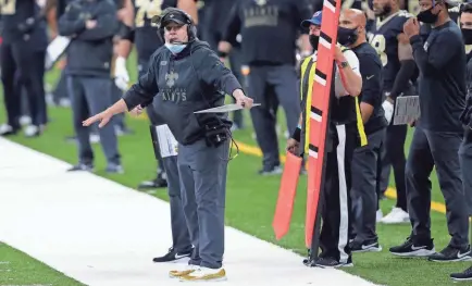  ?? BRETT DUKE/AP ?? Saints coach Sean Payton reacts during a game against the Falcons on Nov. 22 in New Orleans. The NFL fined the Saints $500,000 and stripped them of a 2021 seventh-round draft pick for violating COVID-19 protocols.