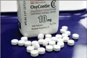  ?? ASSOCIATED PRESS ?? THIS 2013 FILE PHOTO SHOWS OXYCONTIN pills arranged for a photo at a pharmacy in Montpelier, Vt. The maker of the powerful painkiller said it will stop marketing opioid drugs to doctors, a surprise reversal after lawsuits blaming the company for helping trigger the current drug abuse epidemic.