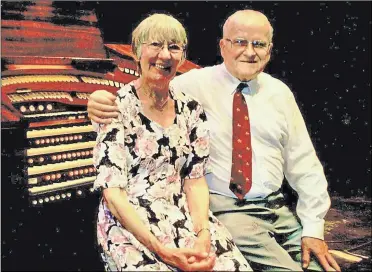  ??  ?? Organist Bob Caudwell pictured with partner Margaret Howe on his 90th birthday