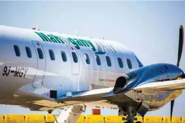  ??  ?? Mahogany’s Embraer at Lusaka’s Kenneth Kaunda Internatio­nal Airport