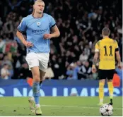  ?? LINDSEY PARNABY ?? on their last visit in May but team to previous seasons. MANCHESTER City’s Norwegian striker Erling Haaland celebrates scoring the second goal during the UEFA Champions League group G football match against Borussia Dortmund. | AFP