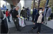  ?? JEFF GRITCHEN — THE ORANGE COUNTY REGISTER ?? Doses of the Pfizer BioNTech COVID-19 vaccine arrive at Providence St. Joseph Hospital in Orange on Wednesday.