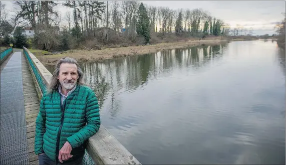  ?? RIC ERNST/PNG ?? Andrew Schulz stands on a footbridge that crosses the Little Campbelll River in White Rock. Schulz and others in the White Rock Safe Water Alliance fear chloramine will damage the environmen­t and kill fish when it runs off into the waterway.