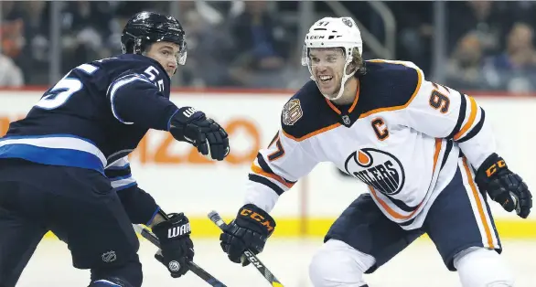  ?? KEVIN KING ?? Edmonton Oilers centre Connor McDavid, right, gets the nod over the Toronto Maple Leafs’ Auston Matthews from Winnipeg centre Mark Scheifele, left.