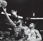  ?? Darren Abate / Associated Press ?? The Celtics’ Jaylen Brown goes inside for a bucket past the Spurs’ LaMarcus Aldridge on Saturday.