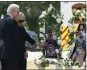  ?? EVAN VUCCI THE ASSOCIATED PRESS ?? President Joe Biden and first lady Jill Biden visit a memorial at Robb Elementary School in Uvalde, Texas, on Sunday to pay their respects to the victims of last week's mass shooting.