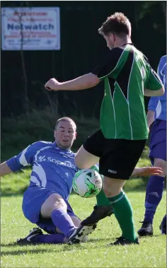  ??  ?? Seán Carmody of Wexford Celtic challenges Crossabeg’s Jamie Creane during their Division 2 match.