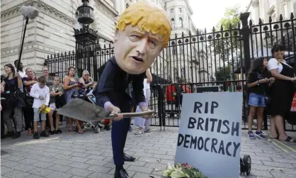  ?? Photograph: Kirsty Wiggleswor­th/AP ?? A protester outside Downing Street on 28 August 2019. ‘Mr Johnson is hijacking powers symbolical­ly vested in the crown and wielding them in aggression against his parliament­ary opponents.’