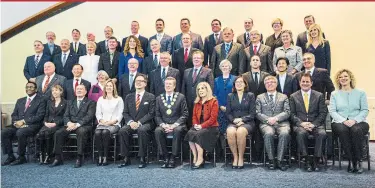  ?? ANDREW FRANCIS WALLACE (TOP) AND BERNARD WEIL TORONTO STAR PHOTOS ?? 2014 TORONTO COUNCIL Mayor John Tory sits front and centre as Toronto’s new council (top) gathers Thursday at city hall for a photo. Four years earlier, Tory presided over a much larger group when the class of 2014 assembled in the same spot.