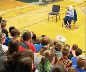  ?? TAWANA ROBERTS — THE NEWS-HERALD ?? Holocaust survivor Regina Wolovits shares her story with Wickliffe Middle School students on Sept. 25.