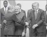  ?? AP ?? ▪ Russian president Vladimir Putin greets Turkey's President Recep Tayyip Erdogan (right) and Prime Minister Narendra Modi (centre) at the BRICS) summit meeting in Johannesbu­rg on Friday.